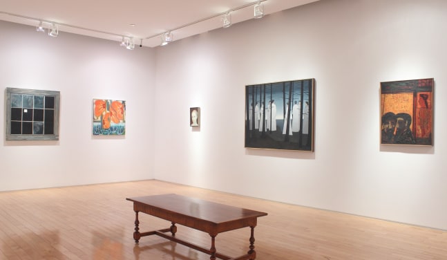 Photograph showing a corner view of an exhibition space with five paintings hanging on white walls