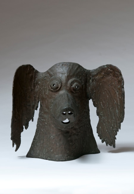 Sculpture of the head of a dog with long ears at alert