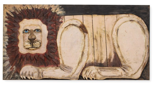 Painted wall-hanging wooden sculpture of an abstracted lion figure
