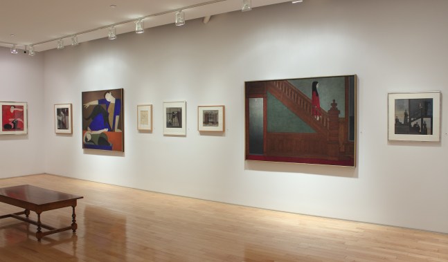 Photograph showing a view of an exhibition space with two paintings and six smaller drawings hanging on a white wall