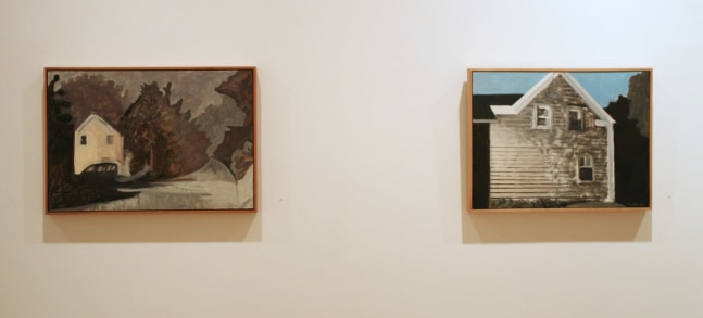 Photograph showing a view of an exhibition, with two small framed paintings hanging on a white wall