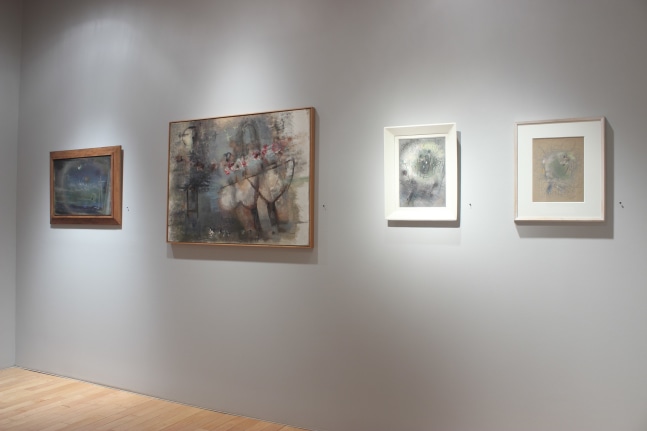 Photograph showing a view of an exhibition with one painting and three small framed drawings