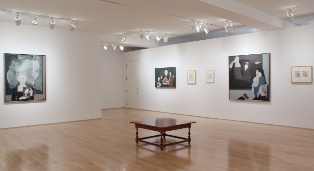 Photograph showing a corner view of an exhibition space, with six paintings hanging on white walls