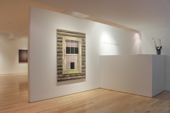 Photograph showing a view of an exhibition space, with one large painting hanging on a white wall