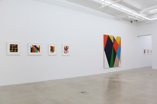 Photograph showing a view of an exhibition space, with eight paintings hanging on a white wall
