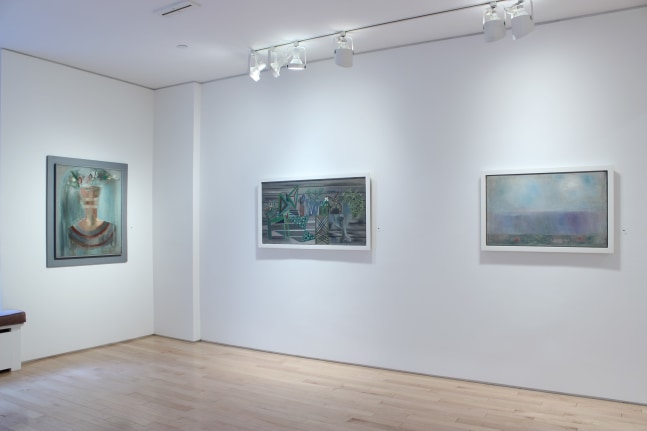 Photograph showing a corner view of an exhibition space, with three paintings hanging on white walls