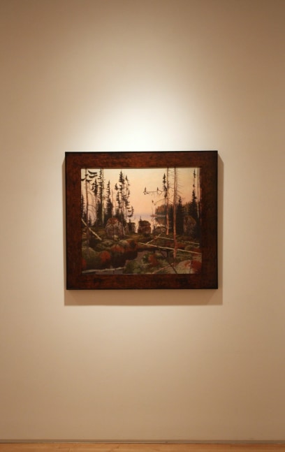 Photograph showing a view of an exhibition, with one framed painting hanging on a white wall