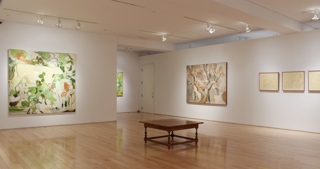 Photograph showing a corner view of an exhibition space, with two paintings and three framed drawings hanging on white walls