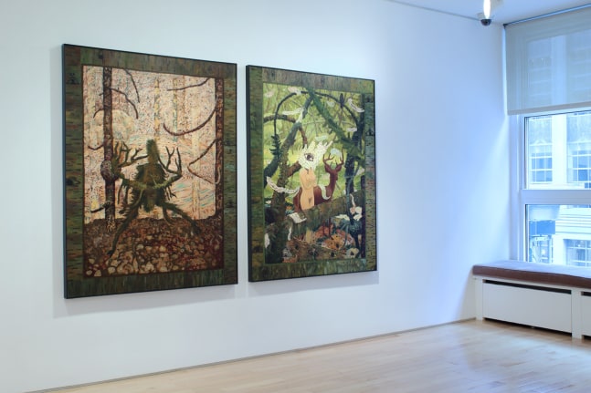 Photograph showing a view of an exhibition space with two paintings hanging on a white wall