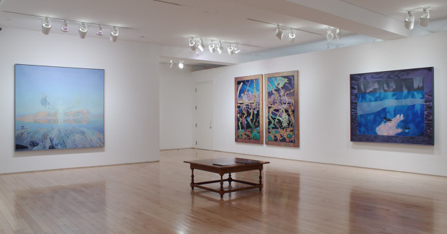 Photograph showing a corner view of an exhibition space with four paintings hanging on white walls