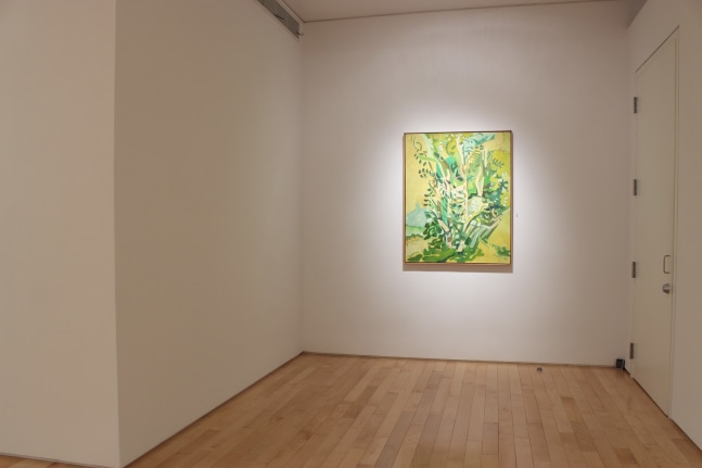 Photograph showing a view of an exhibition space, with one painting hanging on a white wall