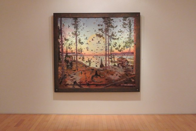 Photograph showing a view of an exhibition, with one framed painting hanging on a white wall