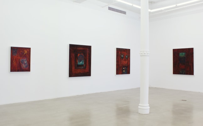 Photograph showing a corner view of an exhibition space, with four paintings hanging on white walls