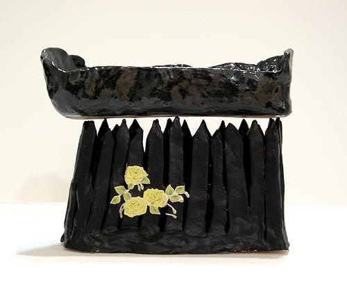 Jessica Jackson Hutchins, French Bread Pizza Coffin on a Fence, 2005, glazed ceramic with collage