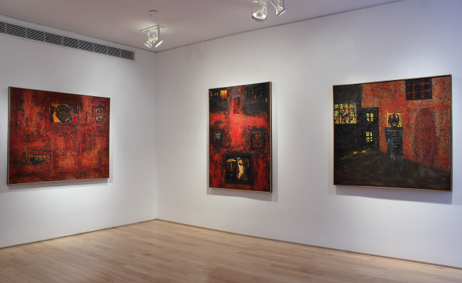 Photograph showing a view of an exhibition space, with three paintings hanging on white walls