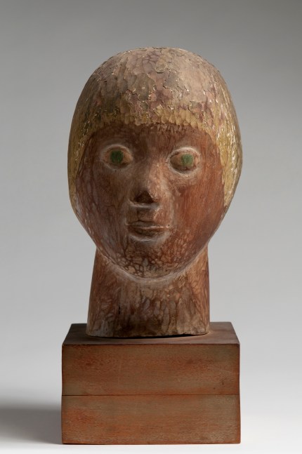 Wood sculpture of a head from the neck up