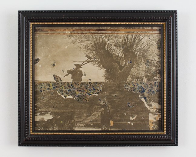 Framed collage made with two black and white photographs showing people working in a field and scraps of patterned paper