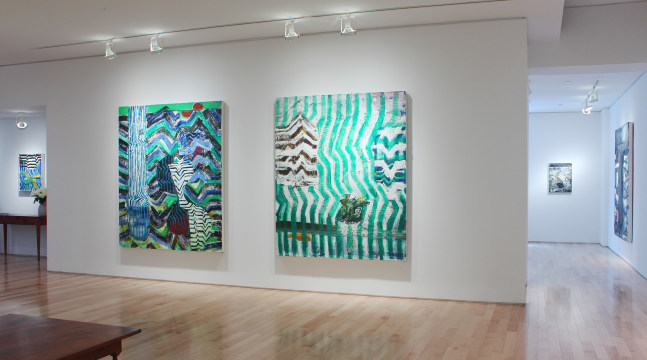 Photograph showing a view of an exhibition space, with two large paintings hanging on white walls