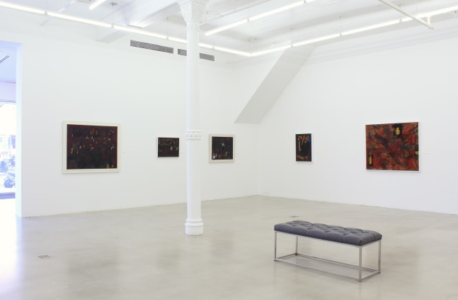 Photograph showing a corner view of an exhibition space, with five paintings hung on white walls