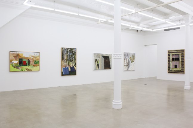 Photograph showing a corner view of an exhibition space, with five paintings hung on white walls