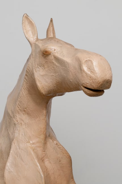 Detail view of a sculpture of a horse, showing the neck and head