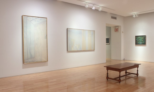 Photograph showing a corner view of an exhibition space, with two large paintings and one smaller painting hanging on white walls