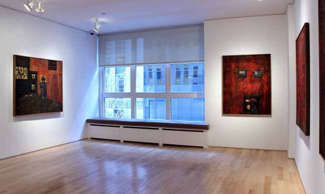 Photograph showing a view of an exhibition space, with three paintings hanging on white walls