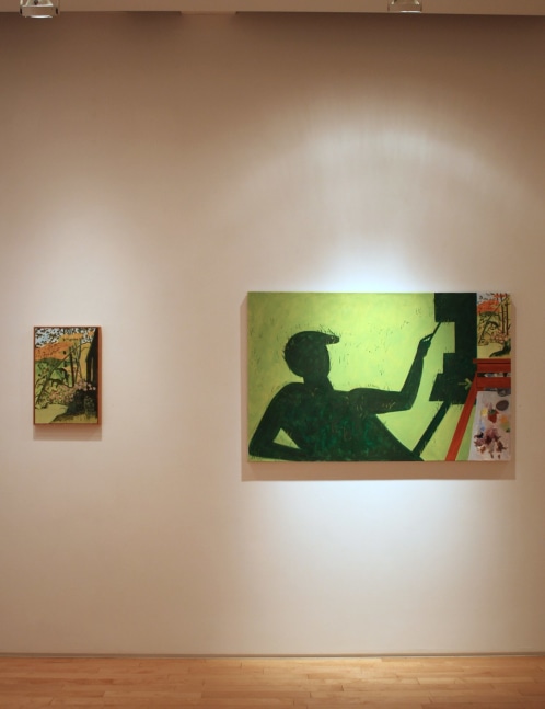 Photograph showing a view of an exhibition, with two paintings hanging on a white wall