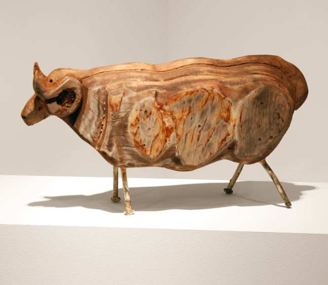 Wood sculpture of a ram