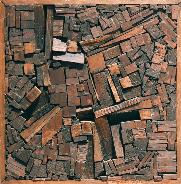 A rectangular, wall-hanging sculpture composed of numerous pieces of wood assembled together