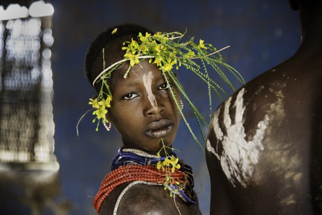 Steve McCurry  Child Adorned with Flowers