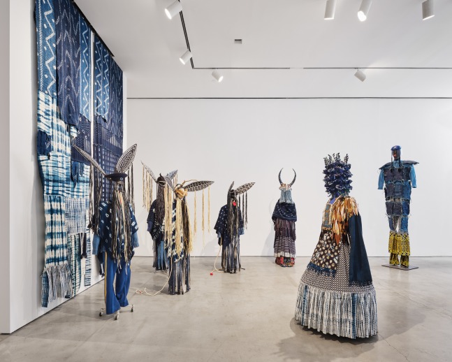 Installation view of &quot;Laura Anderson Barbata: Singing Leaf&quot; showcasing the 'Intervention Indigo' costumes.