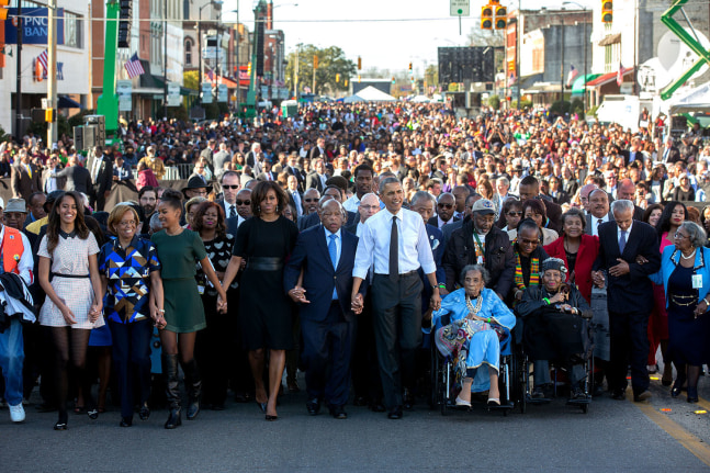 The First Family leads marchers across the Edmund Pettus Bridge, Selma, AL, March 7, 2015 (Courtesy Barack Obama Presidential Library)