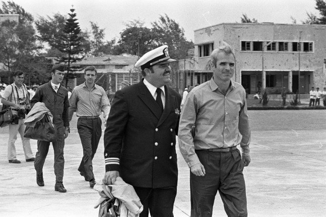 Lt. Commander John McCain escorted to a waiting Air Force aircraft at Gia Lam Airport after his release from prison in Hanoi, Vietnam, March 14, 1973 (U.S. Air Force photo by Tech. Sgt. James L. Baker, Courtesy Images of Freedom)