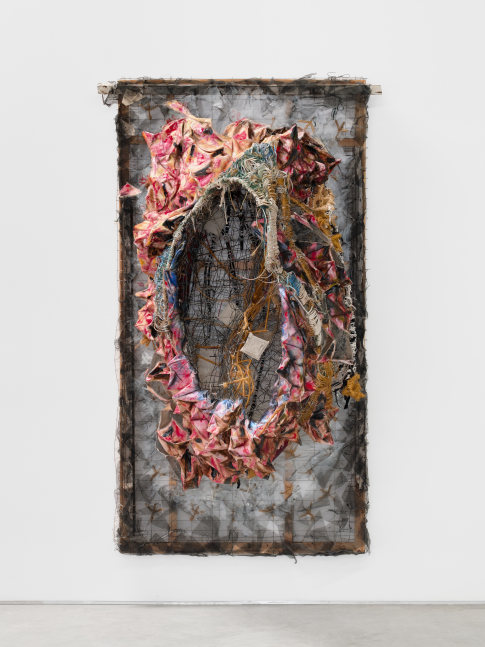 A wall mounted sculpture by Marwa Abdul-Rahman of a wire bed frame covered in canvas and twine with a nest like form protruding from the center.
