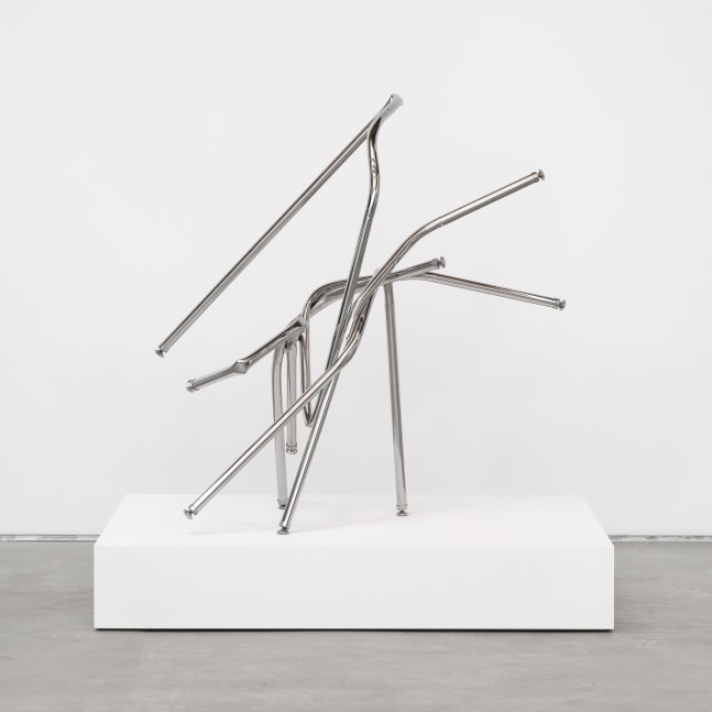 A freestanding sculpture by Josh Callaghan of entangled steel tubing extending diagonally.