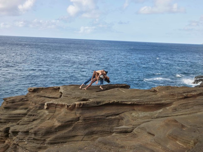 two ballerinas dancing on the cliff