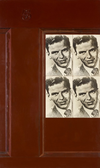 Red brown door with two pasted pictures of Frank Sinatra