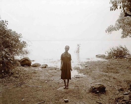 Girl at Lakeshore, Ethiopia, 2006, toned gelatin silver print, 12 x 10 inches