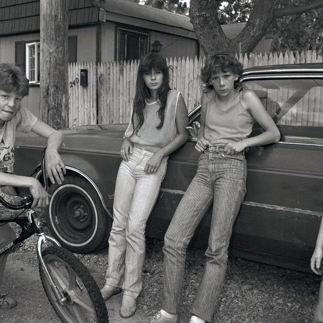 Christine Osinski Two Girls with Big Wheels