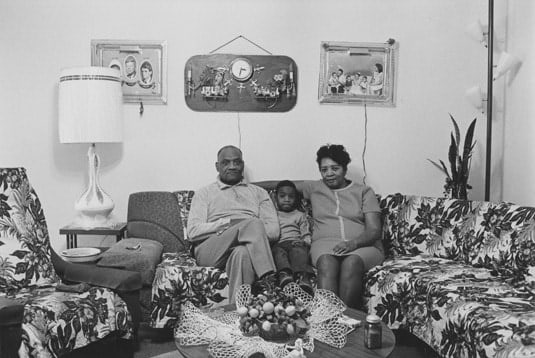 Husband and wife at home with their youngest child, Detroit, 1968