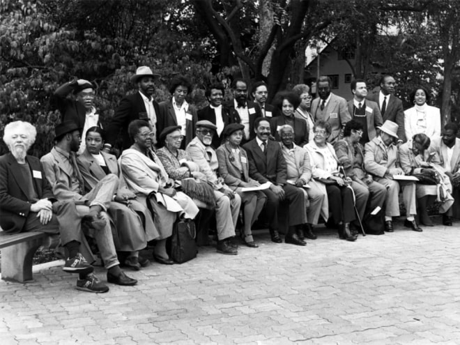 Richard Mayhew (center) with a group of artists he gathered at Penn State University for a conference called &ldquo;Since the Harlem Renaissance,&rdquo; alongside artists and curators including Benny Andrews, Faith Ringgold, Elizabeth Catlett, Lowery Stokes Sims, and many others.