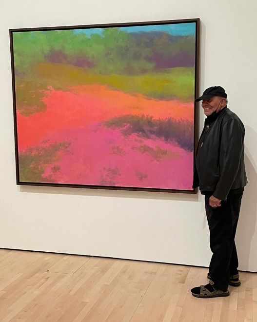 Artist Richard Mayhew poses with his wife Rosemary next to his 2004 painting &ldquo;Pamela&rsquo;s Aura,&rdquo; during a visit to SFMOMA for his 97th birthday.