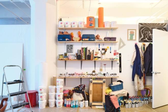 Shelves and buckets of gesso in the artist Ana Benaroya's studio