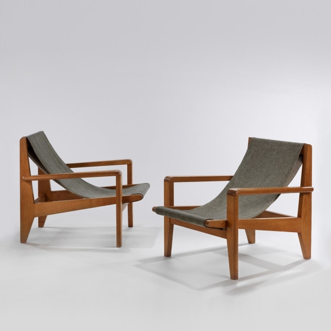 Pair of wood low armchairs with canvas sling seat