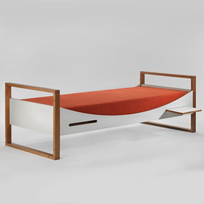 midcentury bed in an empty room
