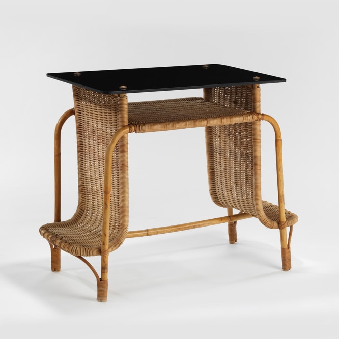 rattan desk in an empty room
