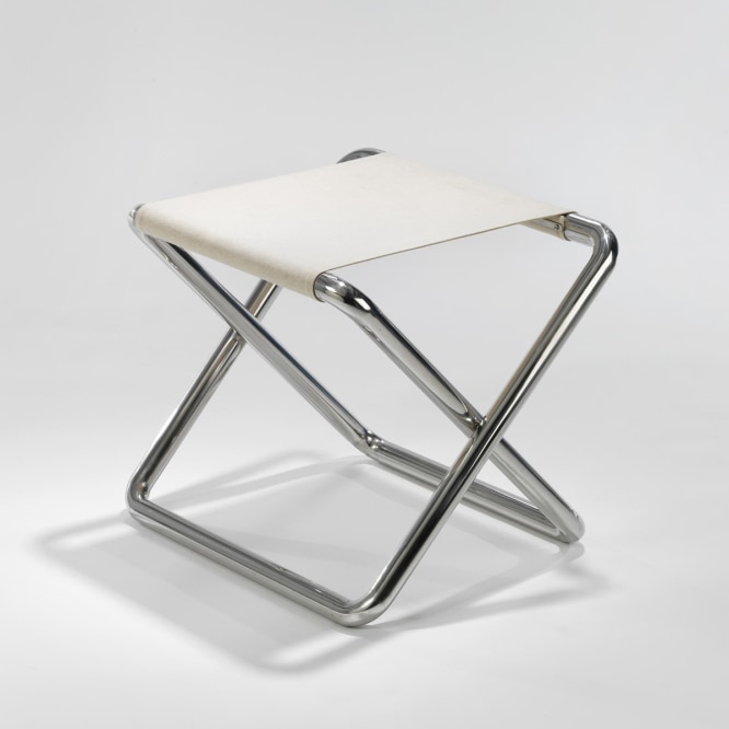 metal folding stool in an empty room