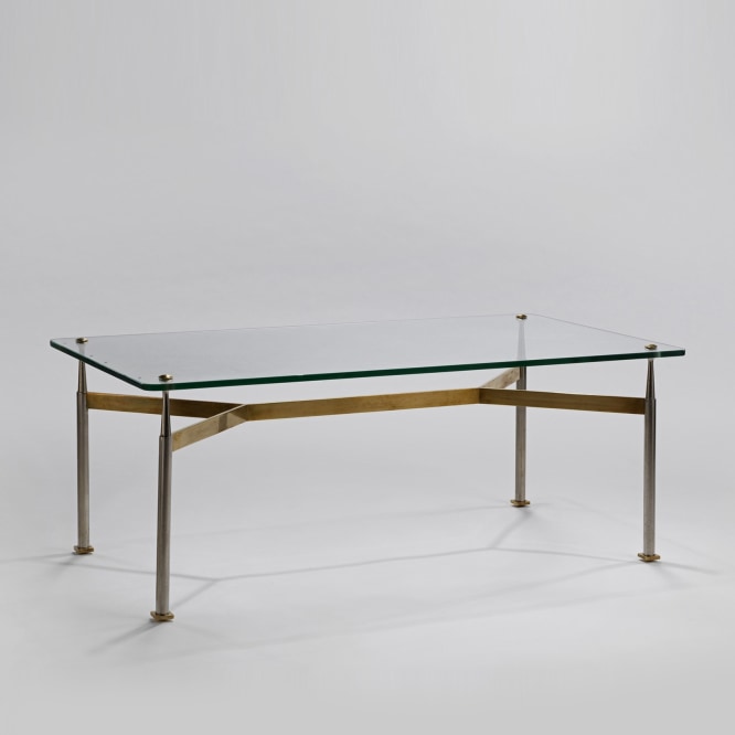 Glass top coffee table with a brass base