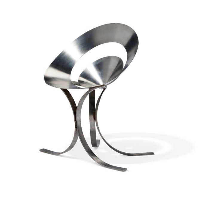 Maria pergay chair made with two rings in steel. On blank white background. 